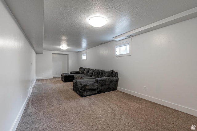 326 E 200 S, Logan, UT 84321 - living room with carpet flooring, a textured ceiling, visible vents, and baseboards