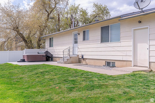 326 E 200 S, Logan, UT 84321 - back of property featuring fence, a lawn, a patio, and a hot tub