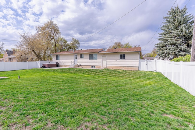 326 E 200 S, Logan, UT 84321 - back of house featuring a lawn, a gate, a patio area, and a fenced backyard