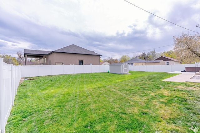 326 E 200 S, Logan, UT 84321 - view of yard featuring a patio area, an outbuilding, a shed, and a fenced backyard