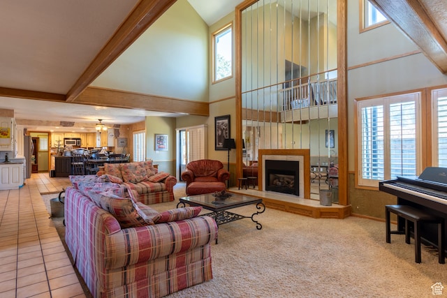 2548 E Cobblestone Way, Sandy, UT 84093 - living room with high vaulted ceiling, a fireplace with raised hearth, healthy amount of natural light, and light colored carpet