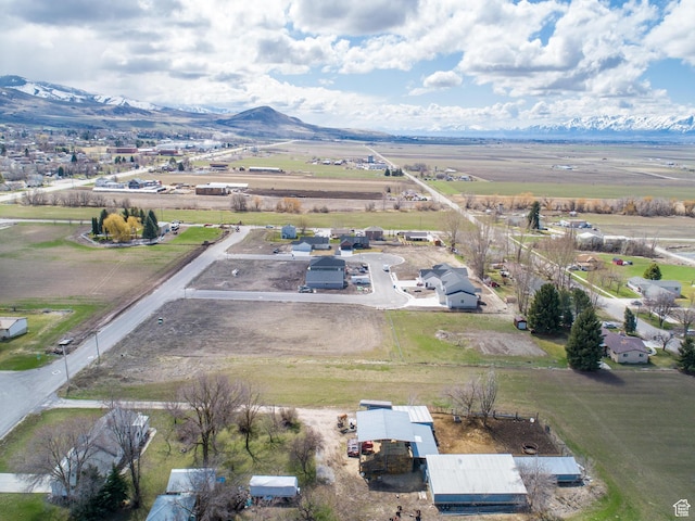 birds eye view of property featuring a mountain view