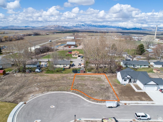 birds eye view of property featuring a mountain view and a residential view
