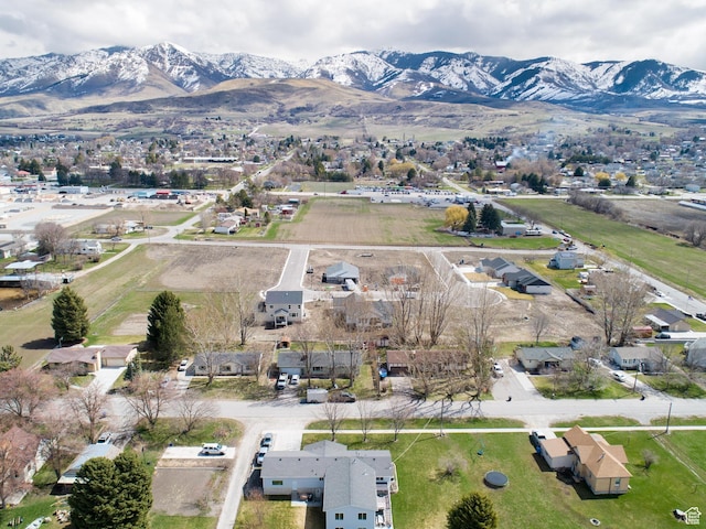 birds eye view of property featuring a mountain view and a residential view