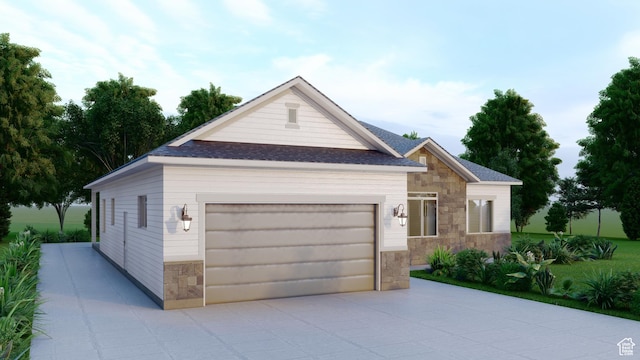view of front of property featuring concrete driveway, stone siding, a garage, and roof with shingles