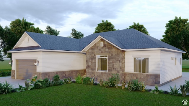 view of front facade with a garage, concrete driveway, a front yard, and stone siding