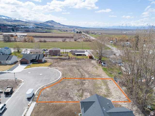 drone / aerial view featuring a mountain view