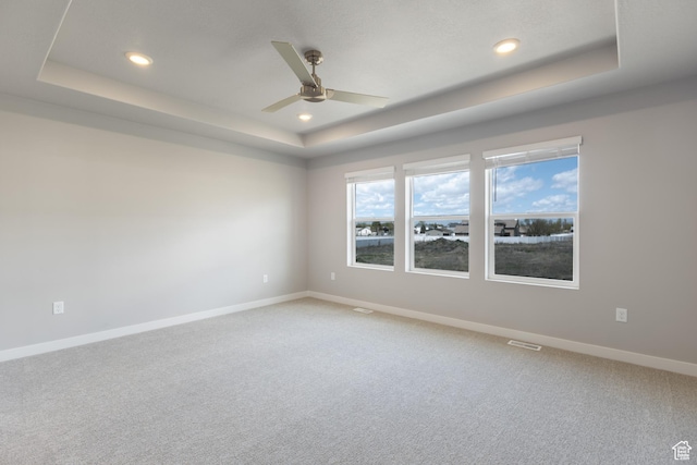 2552 W 2950 N Unit 119, Farr West, UT 84404 - unfurnished room featuring ceiling fan, recessed lighting, a tray ceiling, and light carpet