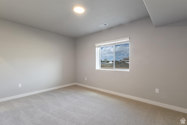 2552 W 2950 N Unit 119, Farr West, UT 84404 - empty room featuring baseboards, visible vents, and light colored carpet