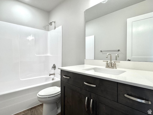 2552 W 2950 N Unit 119, Farr West, UT 84404 - bathroom featuring shower / bathing tub combination, wood finished floors, toilet, and vanity