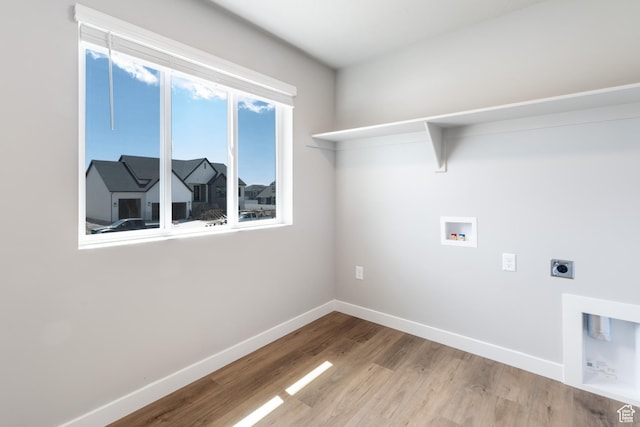 2552 W 2950 N Unit 119, Farr West, UT 84404 - laundry area featuring laundry area, electric dryer hookup, hookup for a washing machine, baseboards, and wood finished floors