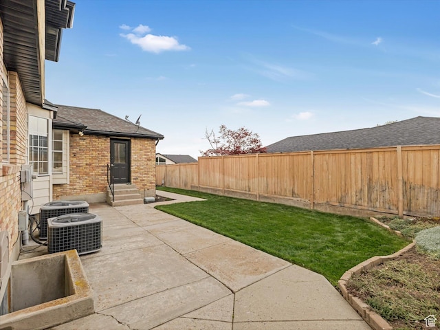 3131 E Alta Hills Dr S, Cottonwood Heights, UT 84093 - view of yard with a fenced backyard, a patio area, central AC, and entry steps