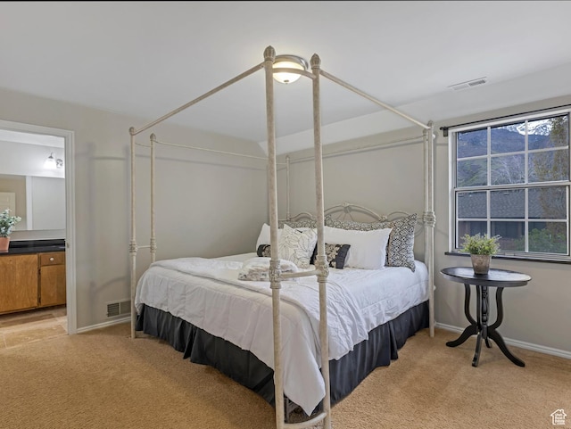 3131 E Alta Hills Dr S, Cottonwood Heights, UT 84093 - bedroom with visible vents, connected bathroom, baseboards, and light carpet