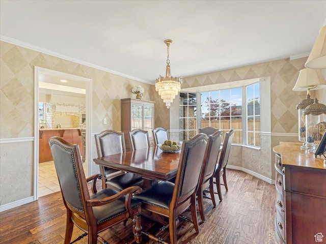 3131 E Alta Hills Dr S, Cottonwood Heights, UT 84093 - dining space featuring wallpapered walls, an inviting chandelier, plenty of natural light, and wood finished floors