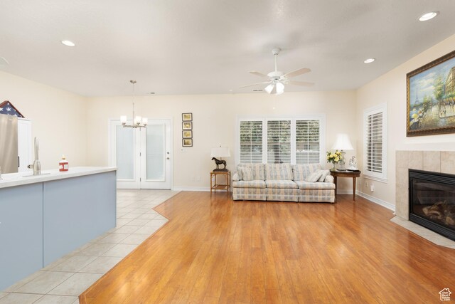 7170 S 420 E, Midvale, UT 84047 - living room with recessed lighting, ceiling fan with notable chandelier, baseboards, and a fireplace
