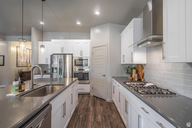 658 N Sage Crest Dr, Washington, UT 84780 - kitchen featuring a sink, decorative backsplash, stainless steel appliances, wall chimney exhaust hood, and dark countertops