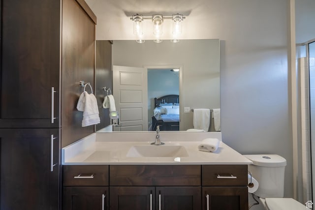 658 N Sage Crest Dr, Washington, UT 84780 - ensuite bathroom featuring toilet, vanity, and connected bathroom