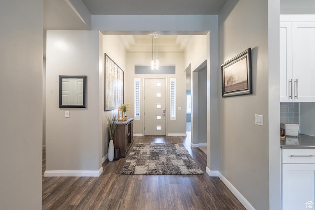 658 N Sage Crest Dr, Washington, UT 84780 - entryway with baseboards and dark wood-type flooring