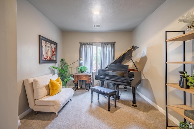 658 N Sage Crest Dr, Washington, UT 84780 - living area featuring a textured ceiling, visible vents, baseboards, and carpet floors