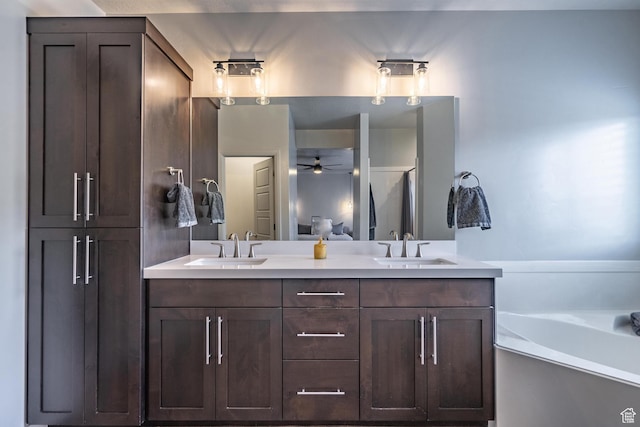 658 N Sage Crest Dr, Washington, UT 84780 - full bath with a bath, double vanity, a sink, and a ceiling fan