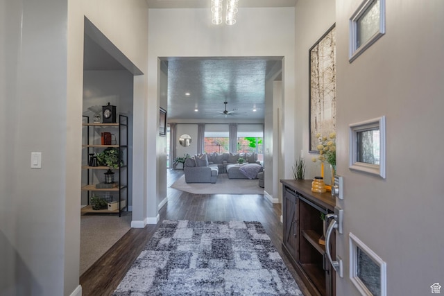 658 N Sage Crest Dr, Washington, UT 84780 - hall featuring dark wood-style flooring, baseboards, and visible vents