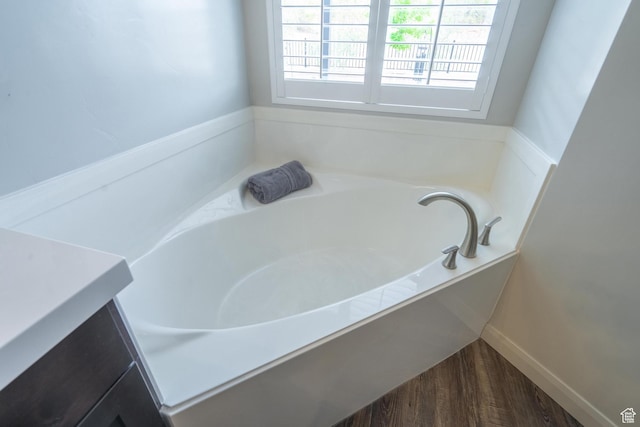 658 N Sage Crest Dr, Washington, UT 84780 - bathroom featuring wood finished floors and a bath