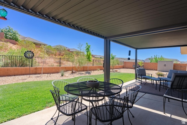 658 N Sage Crest Dr, Washington, UT 84780 - view of patio / terrace featuring outdoor dining area and a fenced backyard