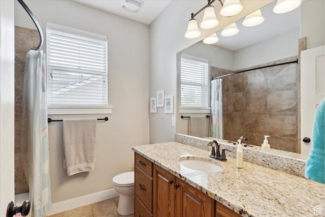 bathroom featuring curtained shower, baseboards, toilet, vanity, and tile patterned flooring