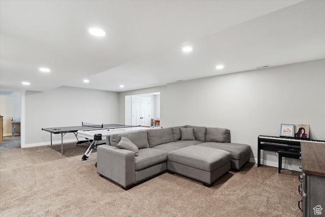 living area featuring visible vents, recessed lighting, light carpet, and baseboards