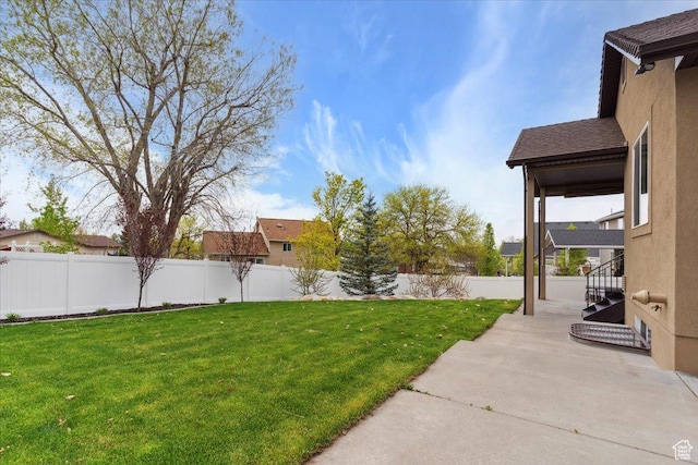 view of yard featuring a patio and fence