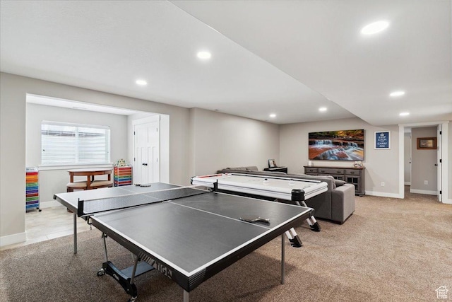 rec room featuring recessed lighting, light colored carpet, and baseboards