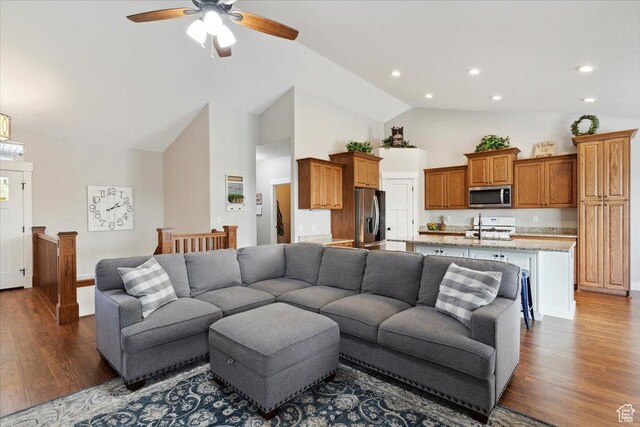 living room featuring dark wood-style floors, high vaulted ceiling, a ceiling fan, and recessed lighting