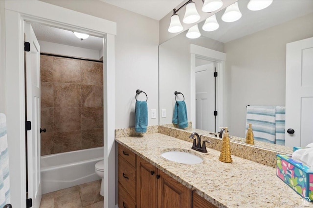 full bathroom featuring tile patterned floors, toilet, and vanity