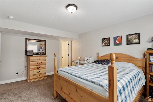 carpeted bedroom featuring baseboards