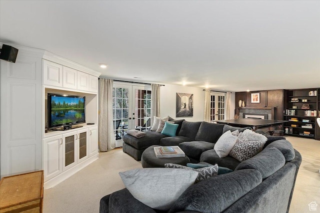 4972 S Boabab Crk, Holladay, UT 84117 - living area featuring french doors, light carpet, and a fireplace