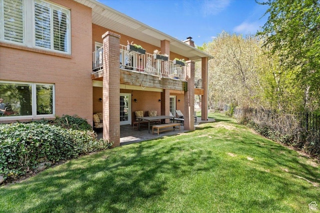 4972 S Boabab Crk, Holladay, UT 84117 - rear view of property with a balcony, a patio, an outdoor living space, a lawn, and brick siding