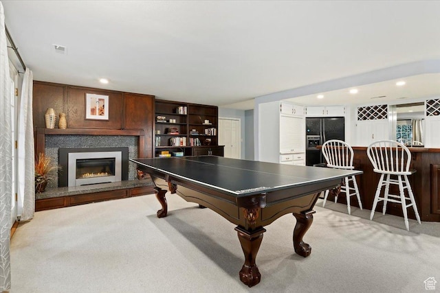 4972 S Boabab Crk, Holladay, UT 84117 - recreation room featuring recessed lighting, visible vents, light carpet, and a glass covered fireplace