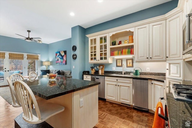 4972 S Boabab Crk, Holladay, UT 84117 - kitchen with a sink, stainless steel appliances, a kitchen breakfast bar, ceiling fan, and a kitchen island