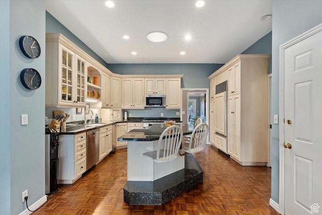 4972 S Boabab Crk, Holladay, UT 84117 - kitchen featuring recessed lighting, a sink, glass insert cabinets, a center island, and appliances with stainless steel finishes
