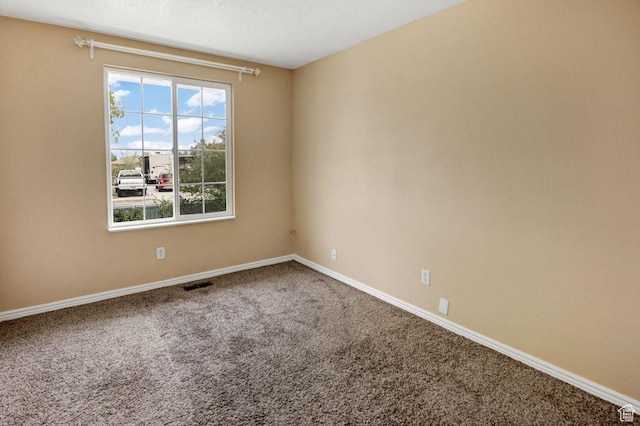 6497 W King Valley Rd, West Valley City, UT 84128 - spare room with visible vents, carpet flooring, and baseboards