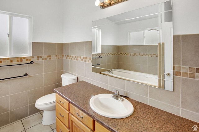 6497 W King Valley Rd, West Valley City, UT 84128 - bathroom featuring toilet, vanity, tile walls, and tile patterned flooring