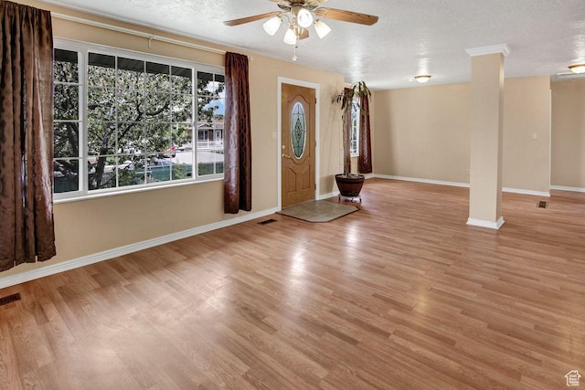 6497 W King Valley Rd, West Valley City, UT 84128 - entrance foyer with visible vents, ceiling fan, wood finished floors, and baseboards