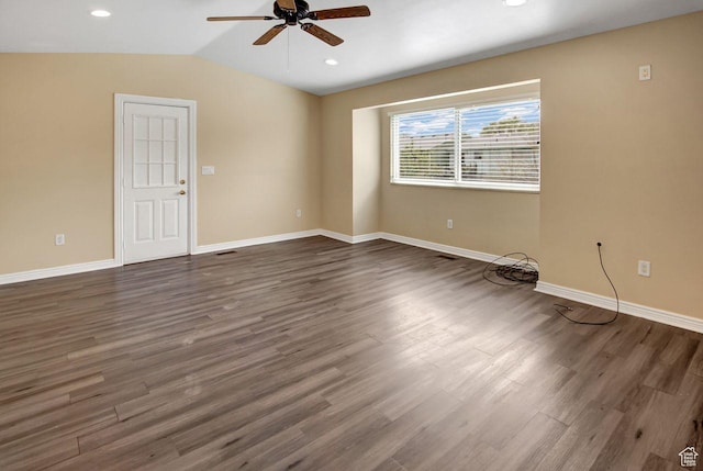 6497 W King Valley Rd, West Valley City, UT 84128 - unfurnished room with dark wood-style flooring, a ceiling fan, vaulted ceiling, and baseboards