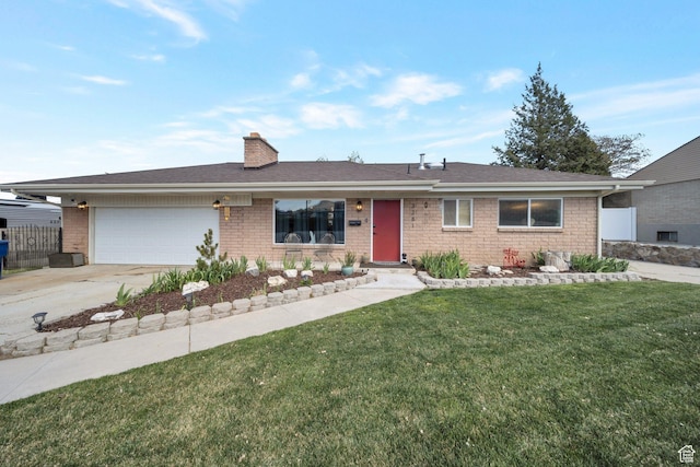 single story home featuring driveway, a chimney, a front lawn, brick siding, and a garage