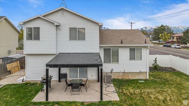 4799 S 3950 W, Roy, UT 84067 - rear view of property with a lawn, a patio, and a fenced backyard