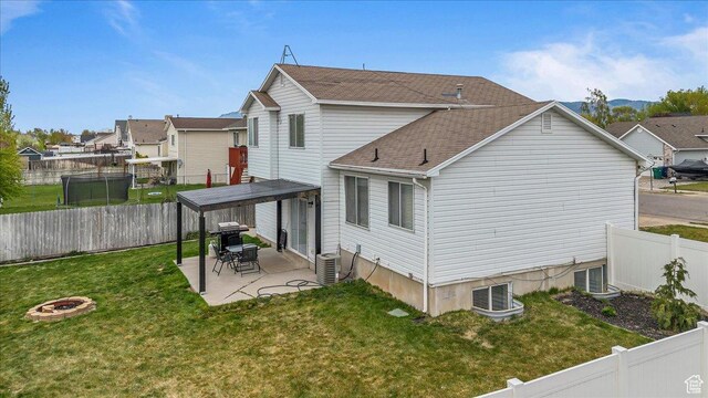 4799 S 3950 W, Roy, UT 84067 - back of house featuring cooling unit, a patio, a residential view, an outdoor fire pit, and a lawn