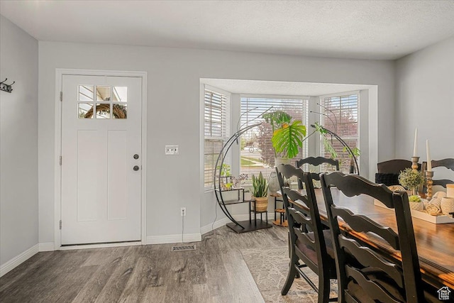 4799 S 3950 W, Roy, UT 84067 - foyer featuring a textured ceiling, wood finished floors, and baseboards