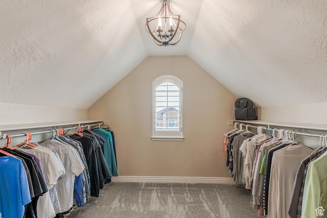 9061 N Clubhouse Ln, Eagle Mountain, UT 84005 - walk in closet with an inviting chandelier, carpet flooring, and lofted ceiling