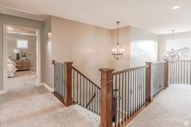 9061 N Clubhouse Ln, Eagle Mountain, UT 84005 - hallway featuring an upstairs landing, a notable chandelier, carpet, and baseboards