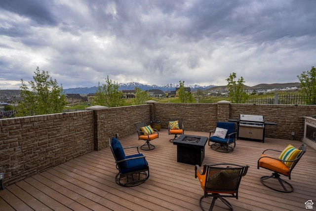 9061 N Clubhouse Ln, Eagle Mountain, UT 84005 - wooden terrace with grilling area, an outdoor fire pit, and a mountain view